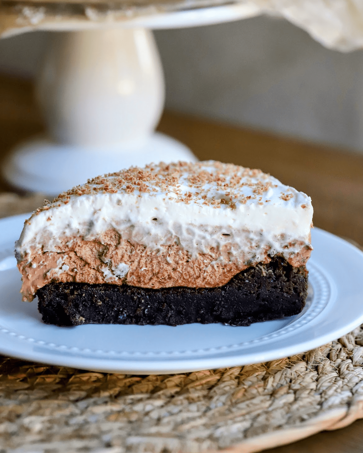 sliced and plated chocolate cheesecake with brownie crust