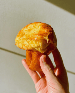 fluffy golden gruyere popovers with whipped cranberry butter