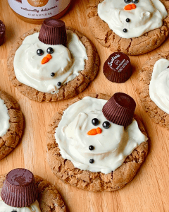melted snowman peanut butter cookies with melted white chocolate peanut butter cups
