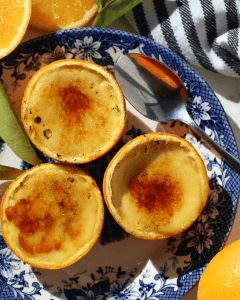 Silky, bright and fresh Orange Crème Brûlée baked up in orange shells