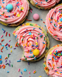 birthday cake cookies topped with creamy buttercream and colorful sprinkles
