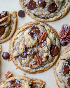 golden-brown butter pecan chocolate chip cookies with melted chocolate chips and toasted pecan pieces, showing their soft, chewy centers and crisp, rippled edges.
