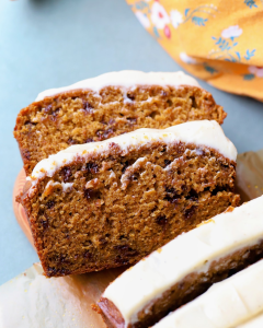 sliced pumpkin bread exposing the tender chocolate chip middle.