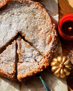 sliced pumpkin butter cake on a cutting board.
